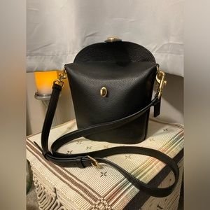 Black Coach crossbody bucket bag.